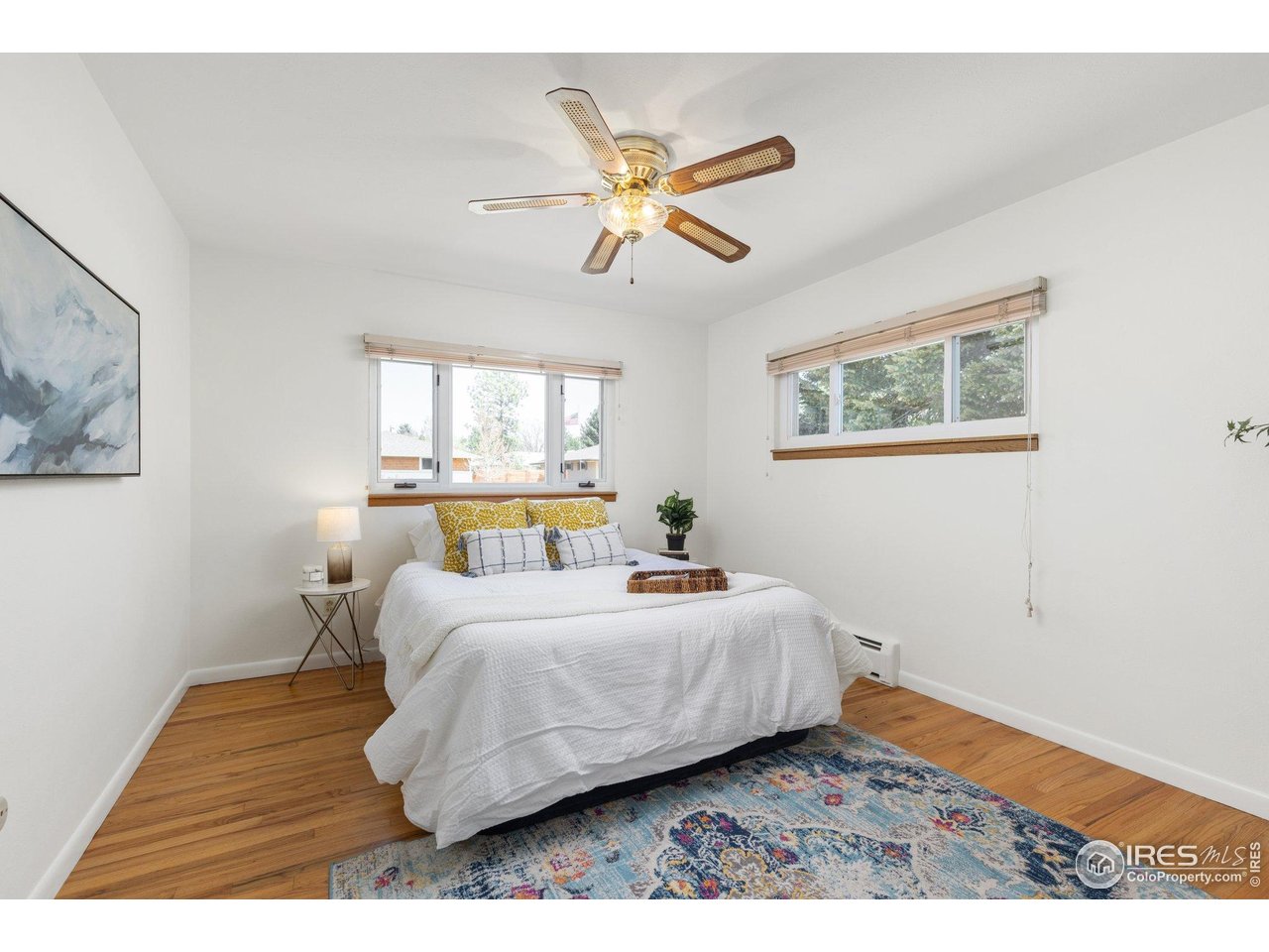 27 Cornell Drive Longmont, CO 80503 - Photo 15 of 33 a bedroom with a bed and window