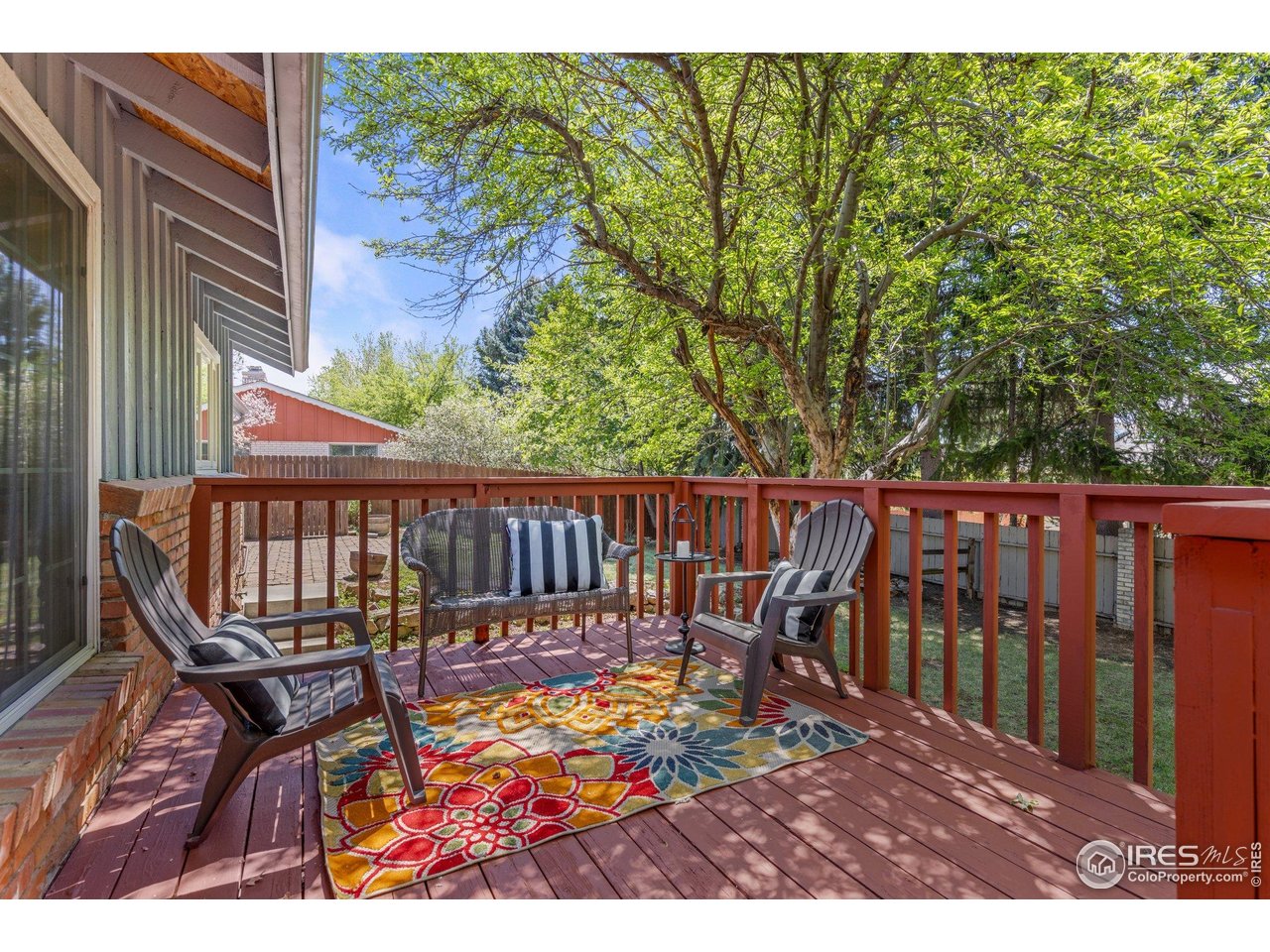 27 Cornell Drive Longmont, CO 80503 - Photo 25 of 33 a view of a wooden chairs on the deck