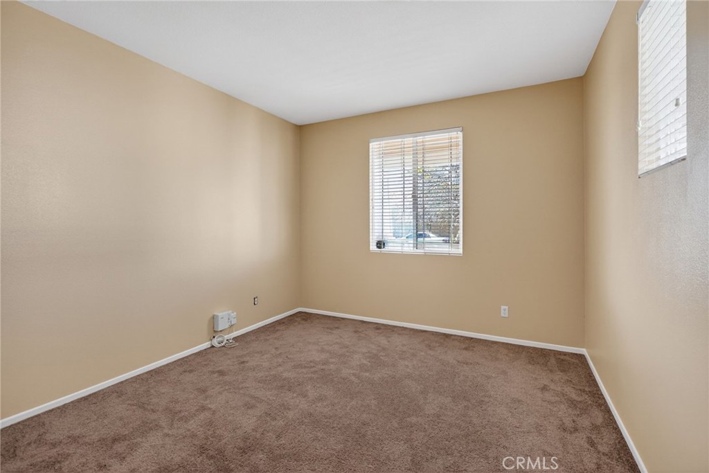 3958 Barbury Palms Way Perris, CA 92571 - Photo 15 of 35 an empty room with windows