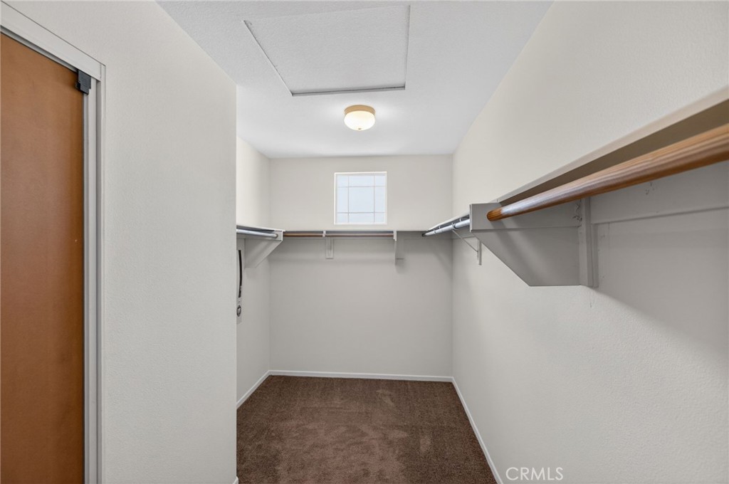 3958 Barbury Palms Way Perris, CA 92571 - Photo 23 of 35 a view of a room with racks on the wall