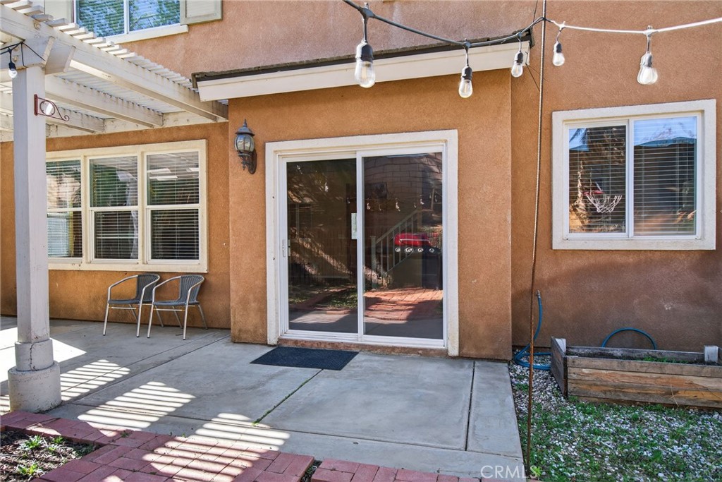 3958 Barbury Palms Way Perris, CA 92571 - Photo 32 of 35 a view of a house with a large window and wooden floor