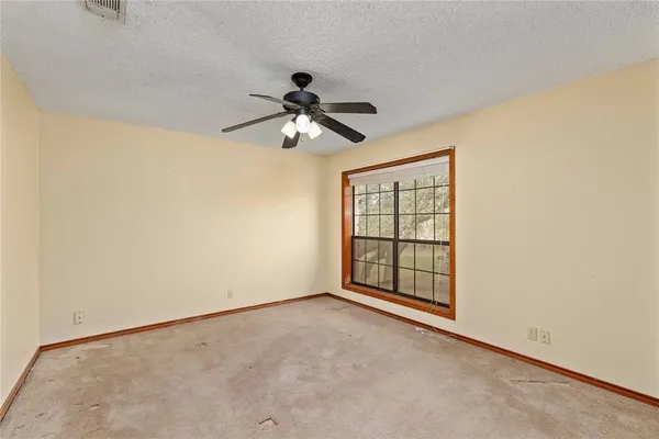 a view of an empty room and window