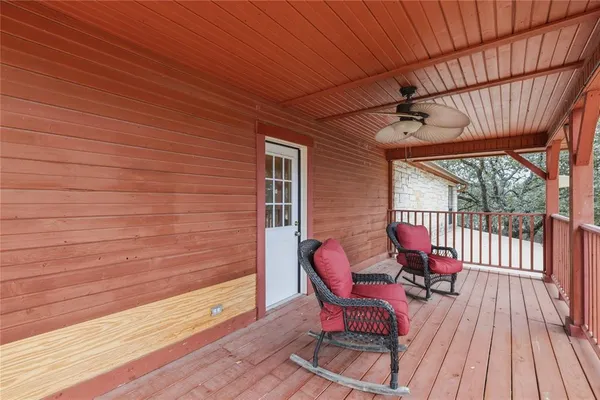 a view of a two chairs in the balcony