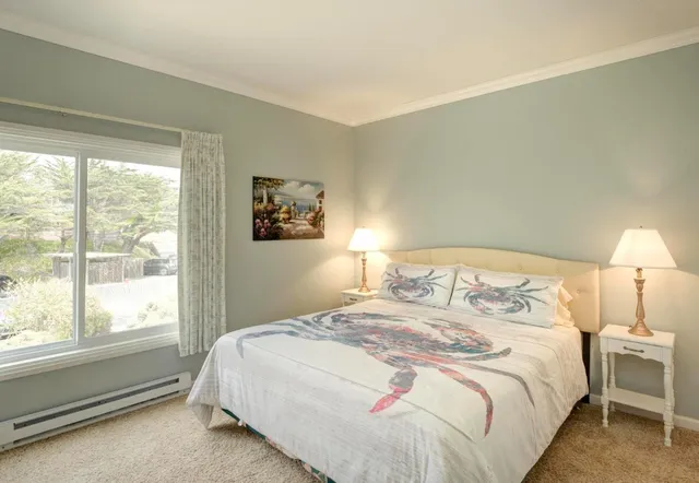 a bedroom with a bed and a lamp with window