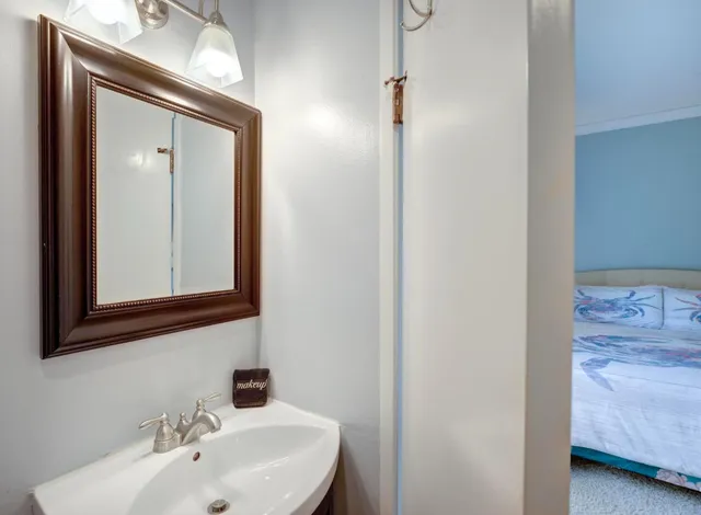 a bathroom with a sink and a mirror