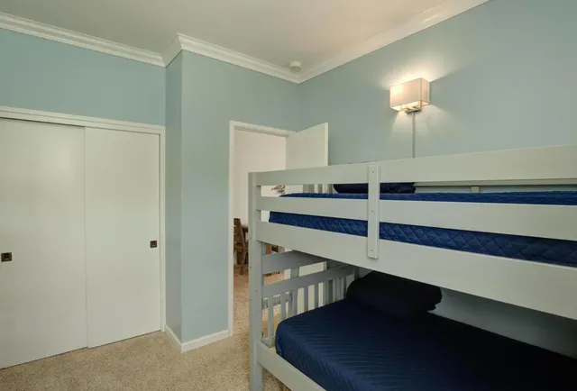 a bedroom with furniture and a window