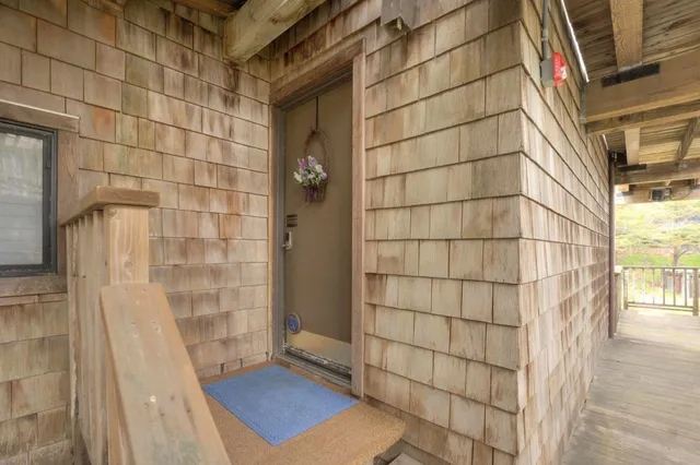 a view of a brick building next to a yard