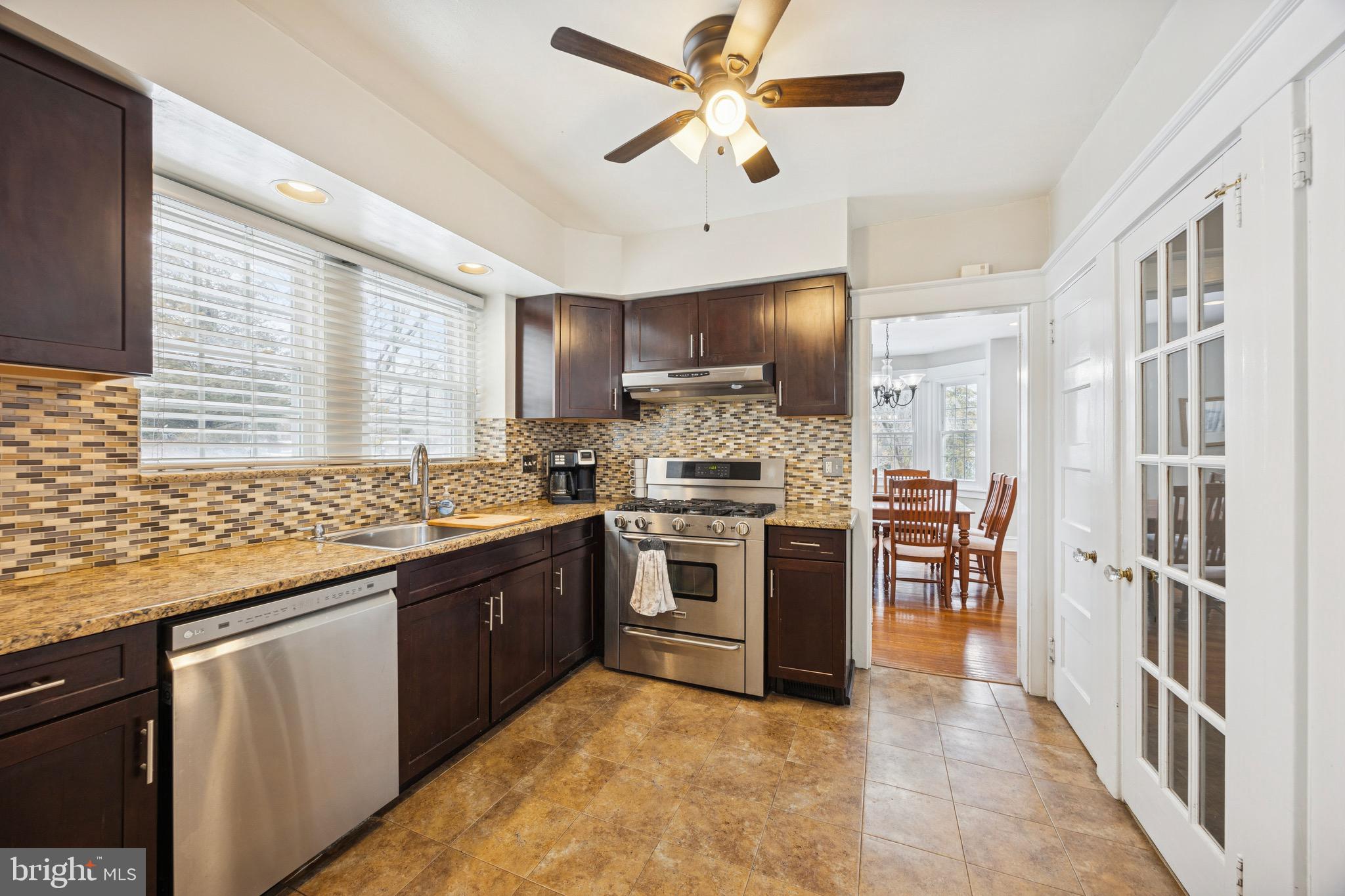 120 West Springfield Road Springfield, PA 19064 - Photo 11 of 35 a kitchen with stainless steel appliances granite countertop a stove and a sink