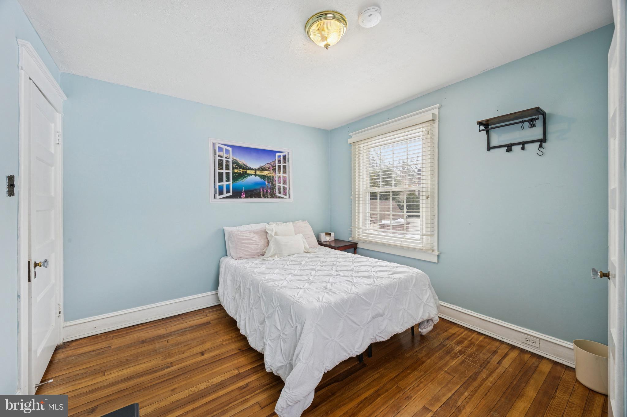 120 West Springfield Road Springfield, PA 19064 - Photo 21 of 35 a bedroom with a bed and a window