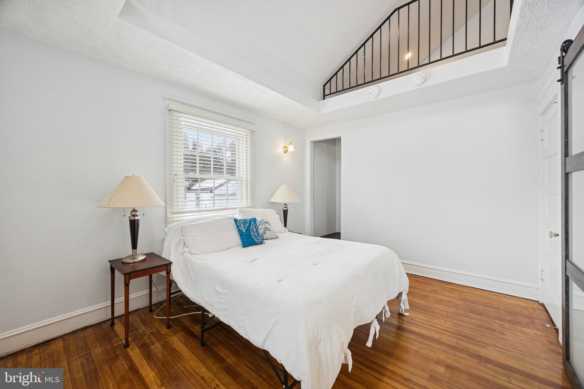 120 West Springfield Road Springfield, PA 19064 - Photo 24 of 35 a bedroom with a bed and a window
