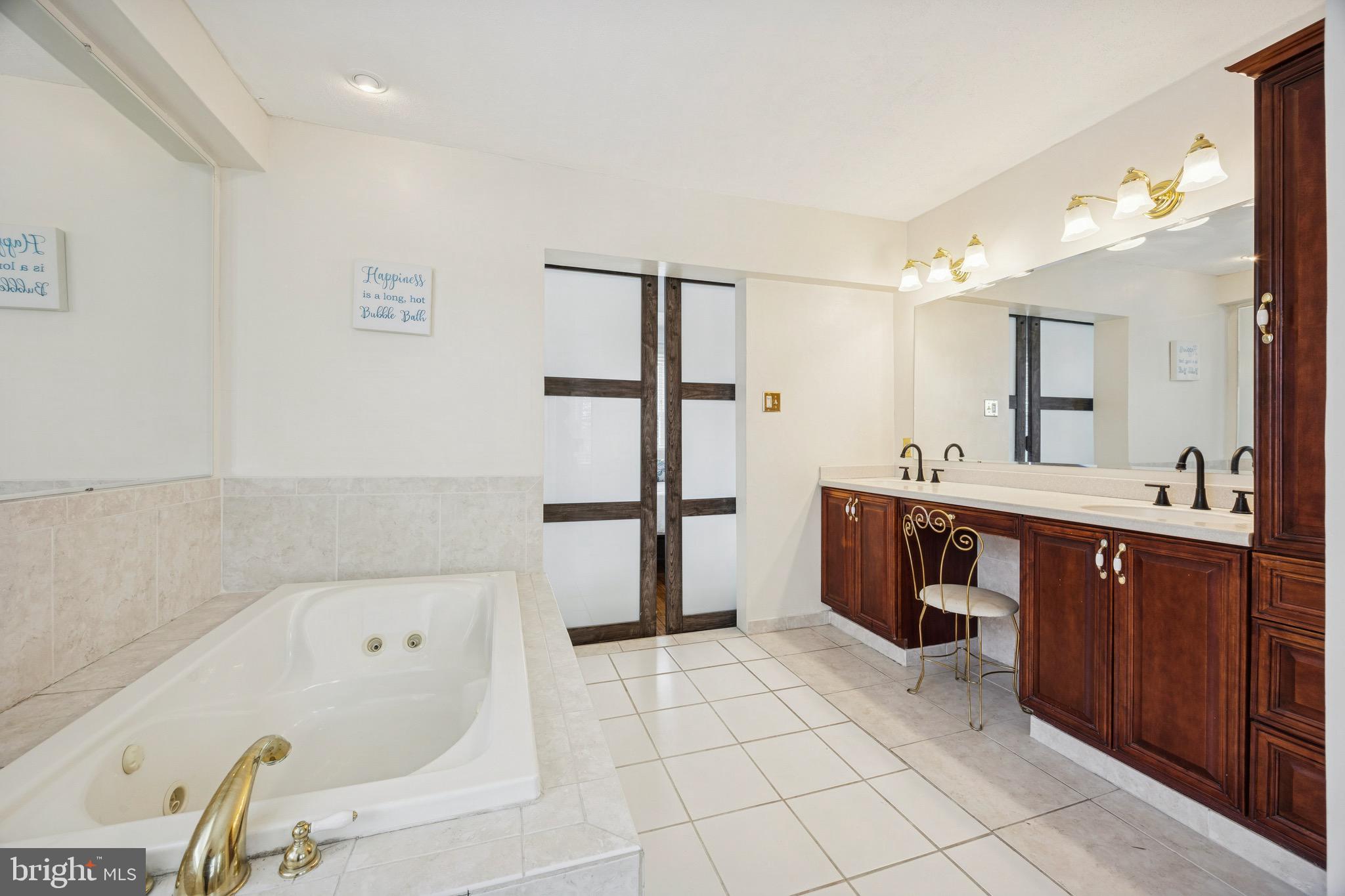 120 West Springfield Road Springfield, PA 19064 - Photo 27 of 35 a bathroom with a bathtub sink and mirror