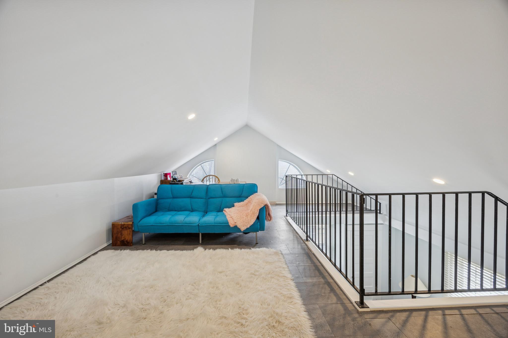 120 West Springfield Road Springfield, PA 19064 - Photo 28 of 35 a room with stairs and a potted plant on a table