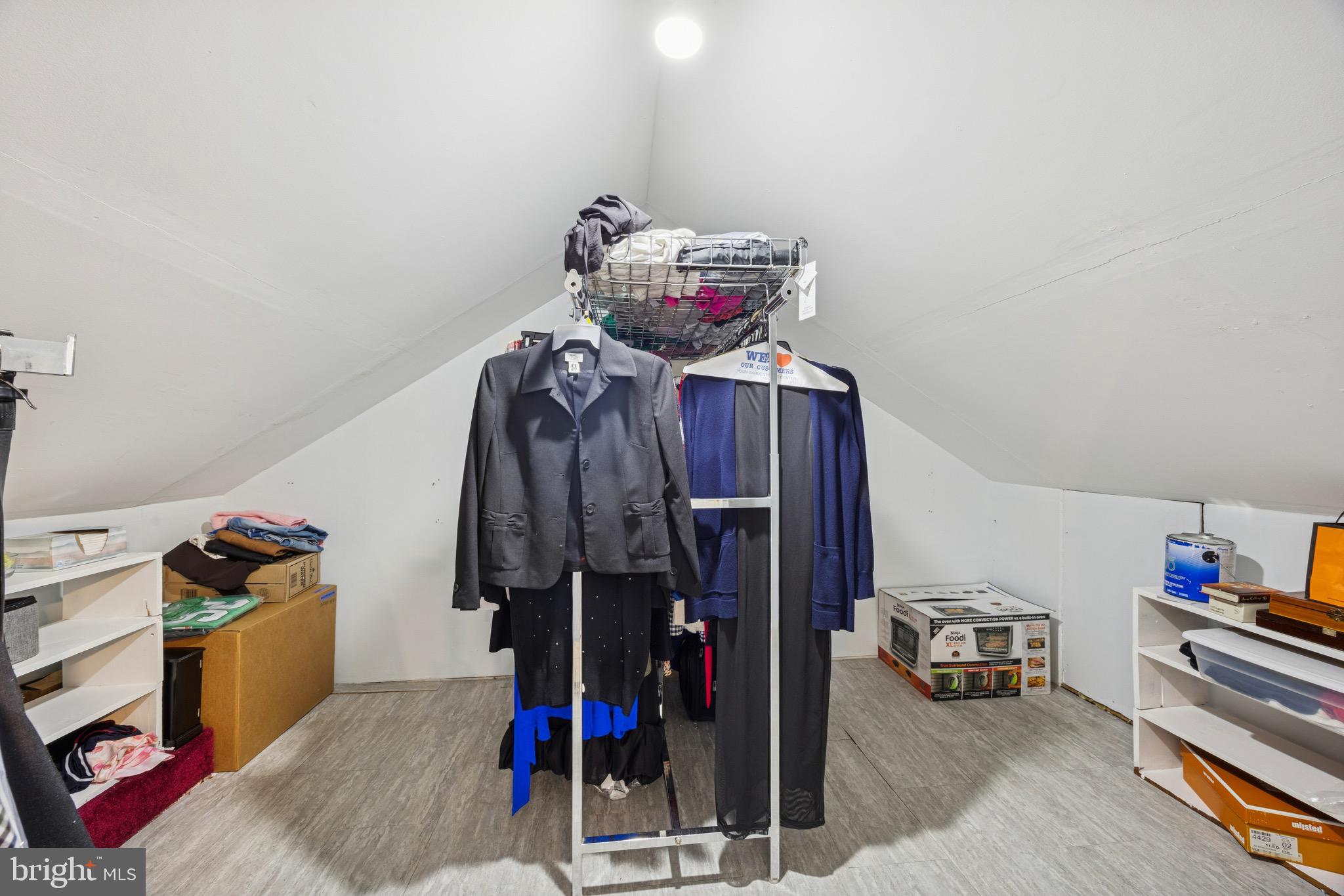 120 West Springfield Road Springfield, PA 19064 - Photo 29 of 35 a view of a bedroom with clothes and shoes