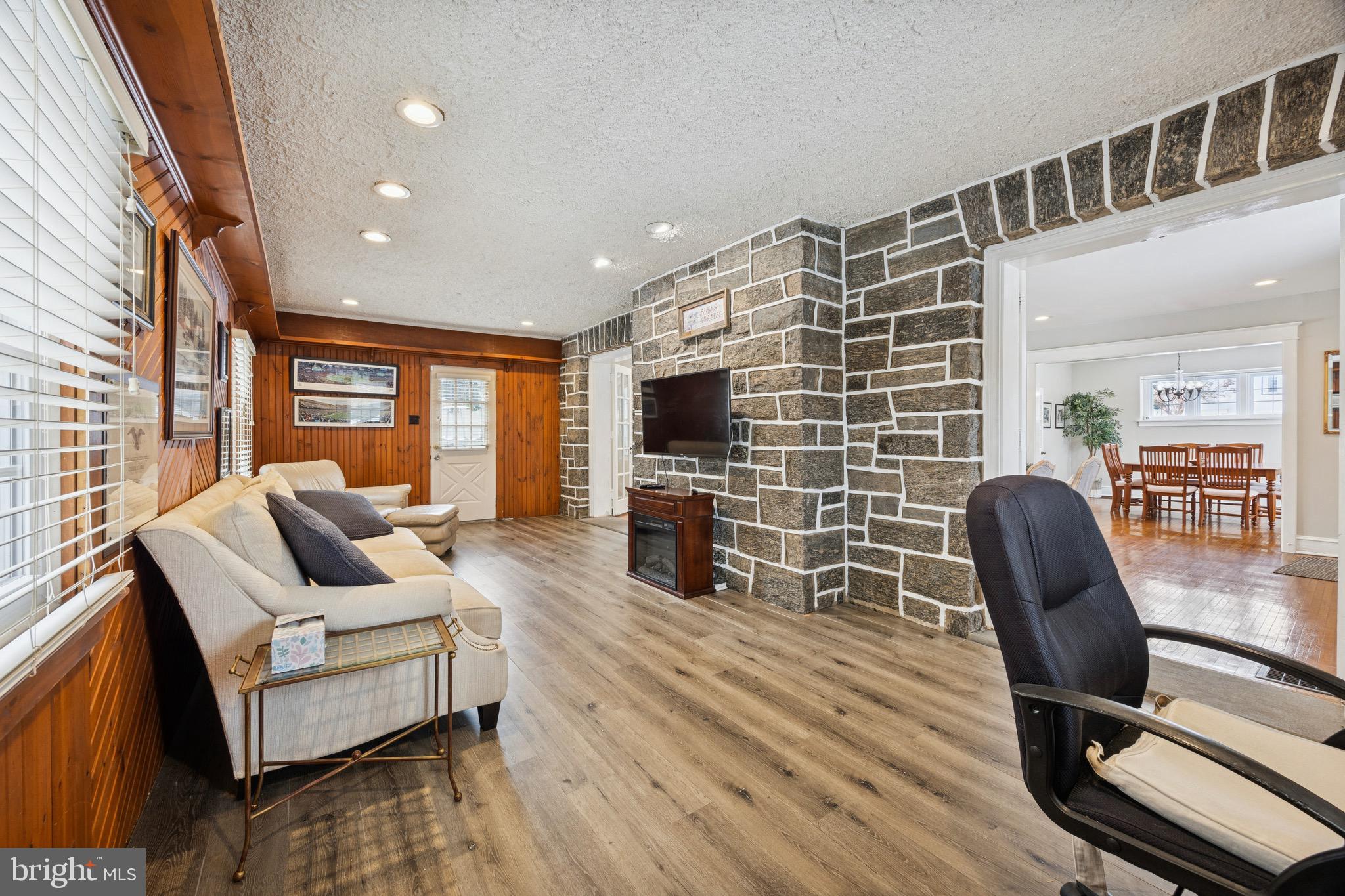 120 West Springfield Road Springfield, PA 19064 - Photo 8 of 35 a living room with furniture and a flat screen tv