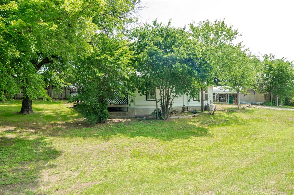 199 B.C. Rhome Avenue Rhome, TX 76078 - Photo 6 of 34 a view of a house with a yard