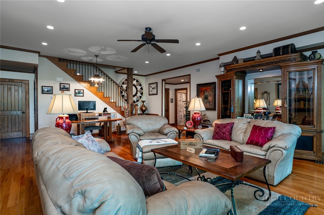 171 Camp Davis Road Banner Elk, NC 28604 - Photo 28 of 48 a living room with lots of furniture and a chandelier