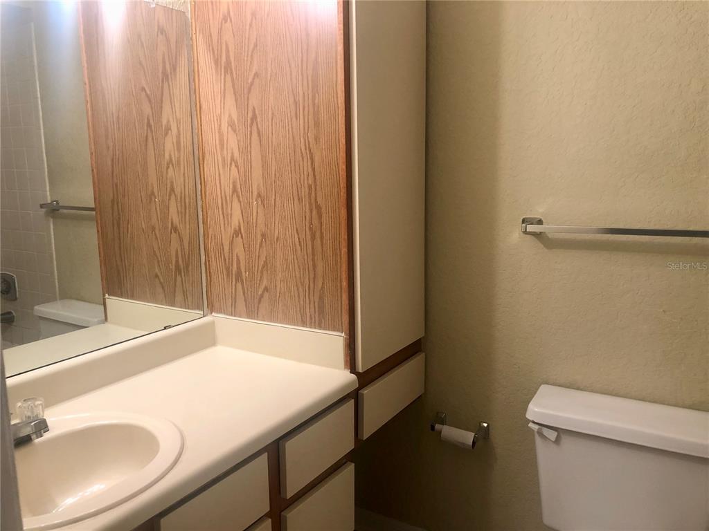 1049 South Hiawassee Road, Unit 3422 Orlando, FL 32835 - Photo 9 of 14 a bathroom with a sink and a toilet