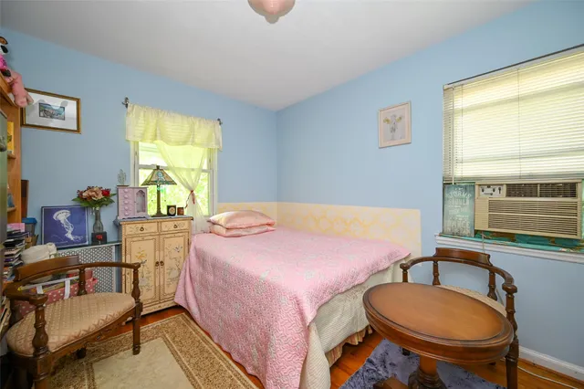 a bedroom with a bed and a table in it