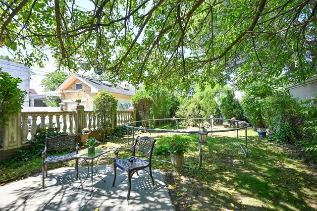 a view of backyard with a patio and outdoor seating