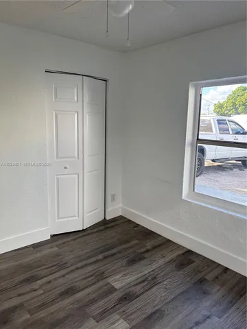 a kitchen with stainless steel appliances granite countertop a stove and a microwave