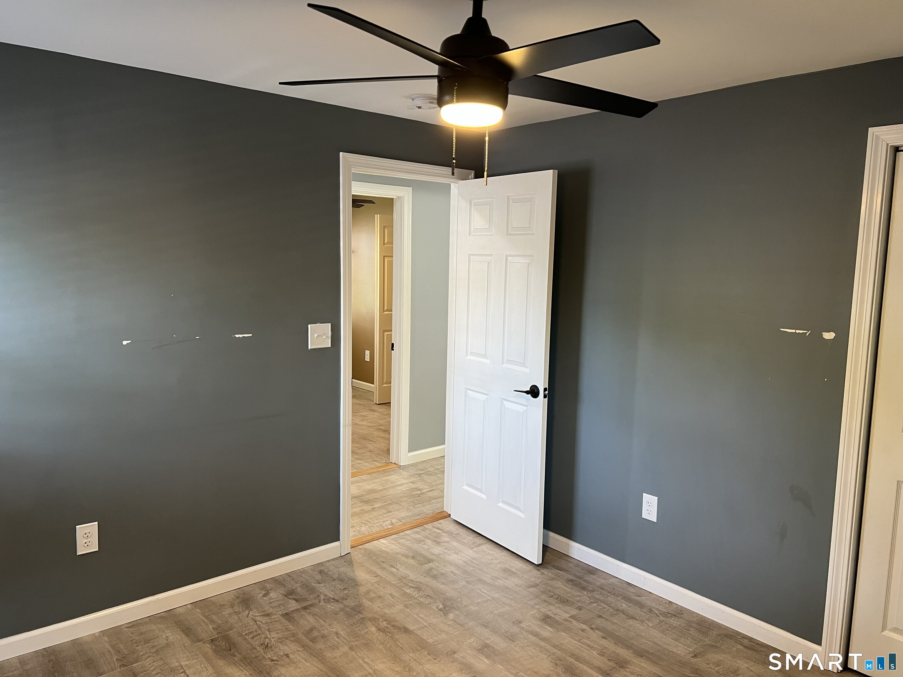 82 Bingham Street Bristol, CT 06010 - Photo 29 of 40 an empty room with closet and a chandelier fan