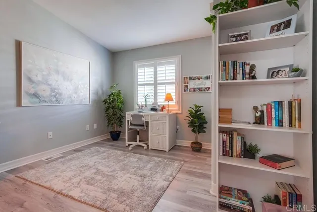 a workspace room with windows and closet