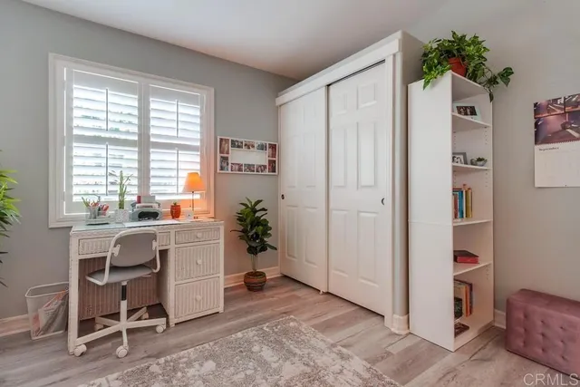 a bedroom with furniture and a window