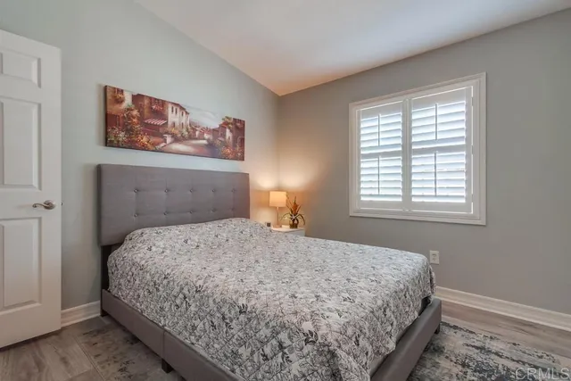 a bedroom with a bed and dresser