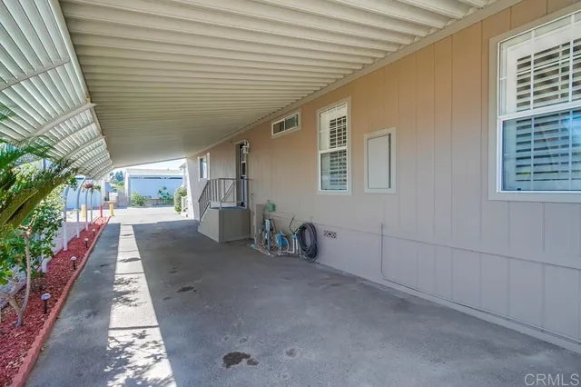 a view of entryway with flower plants