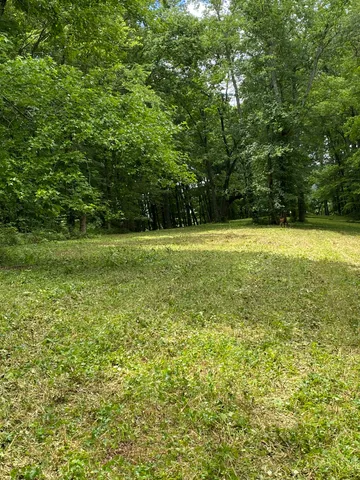 a view of a field with an outdoor space