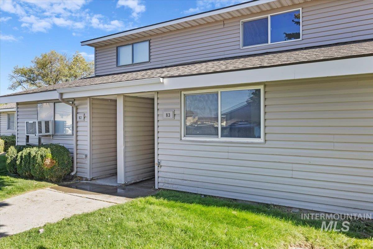 259 Pheasant Road, Unit 83 Twin Falls, ID 83301 - Photo 2 of 26 Siding exterior with multiple windows, pitched roof, and concrete pathways