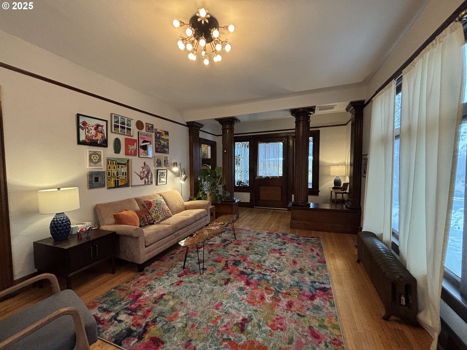 314 Northwest 4th Street Pendleton, OR 97801 - Photo 5 of 7 a living room with furniture and a chandelier