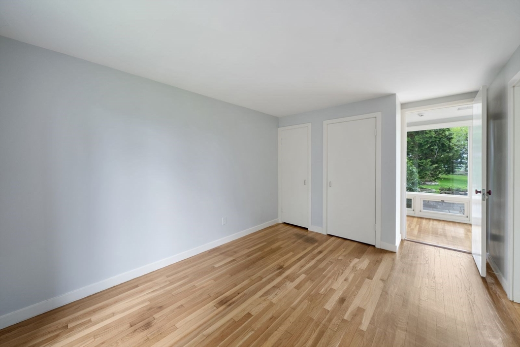 3 Proctor Street Manchester, MA 01944 - Photo 32 of 40 a view of an empty room with wooden floor and a window