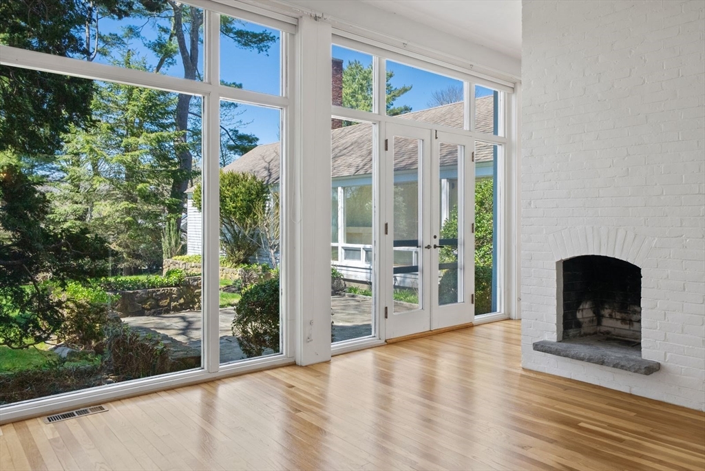 3 Proctor Street Manchester, MA 01944 - Photo 10 of 40 a view of a balcony with furniture and floor to ceiling window