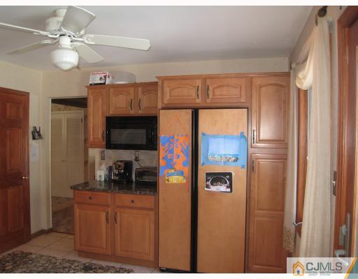 6 Sherwood Road Edison, NJ 08820 - Photo 3 of 10 a kitchen with stainless steel appliances a refrigerator and a sink