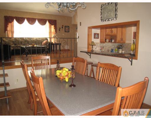 6 Sherwood Road Edison, NJ 08820 - Photo 5 of 10 a view of a dining room with furniture window and outside view