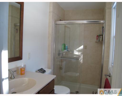 6 Sherwood Road Edison, NJ 08820 - Photo 9 of 10 a bathroom with a shower and a sink
