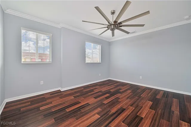 a view of room with window and wooden floor