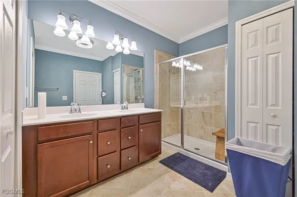 a bathroom with a double vanity sink and a mirror