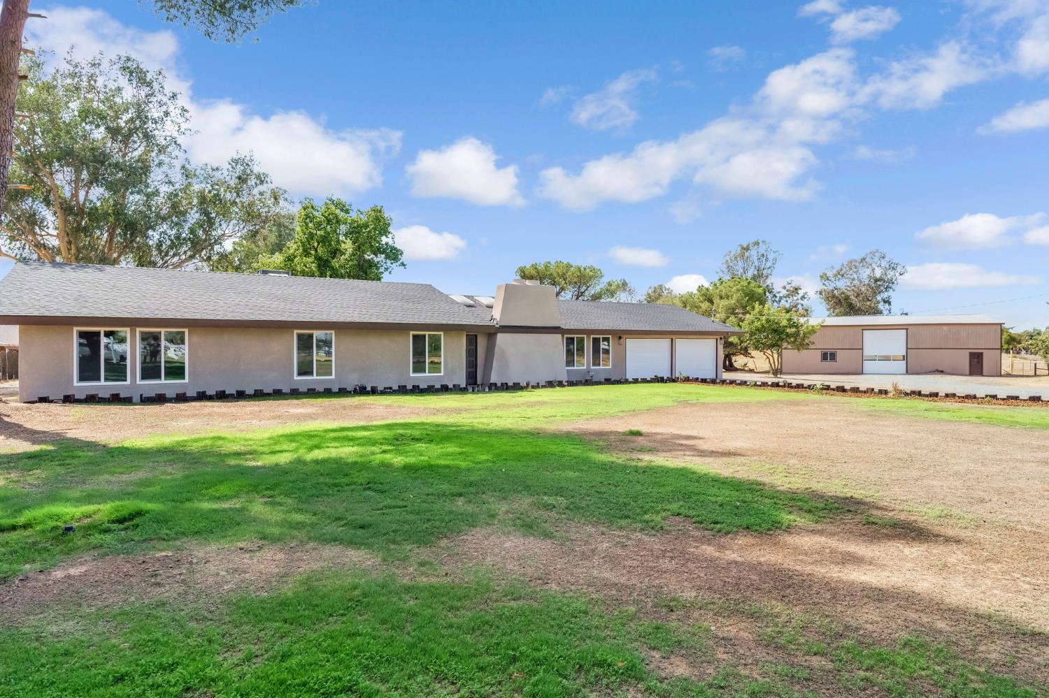 16860 Mark Road Madera, CA 93636 - Photo 1 of 44 a front view of a house with a garden and porch