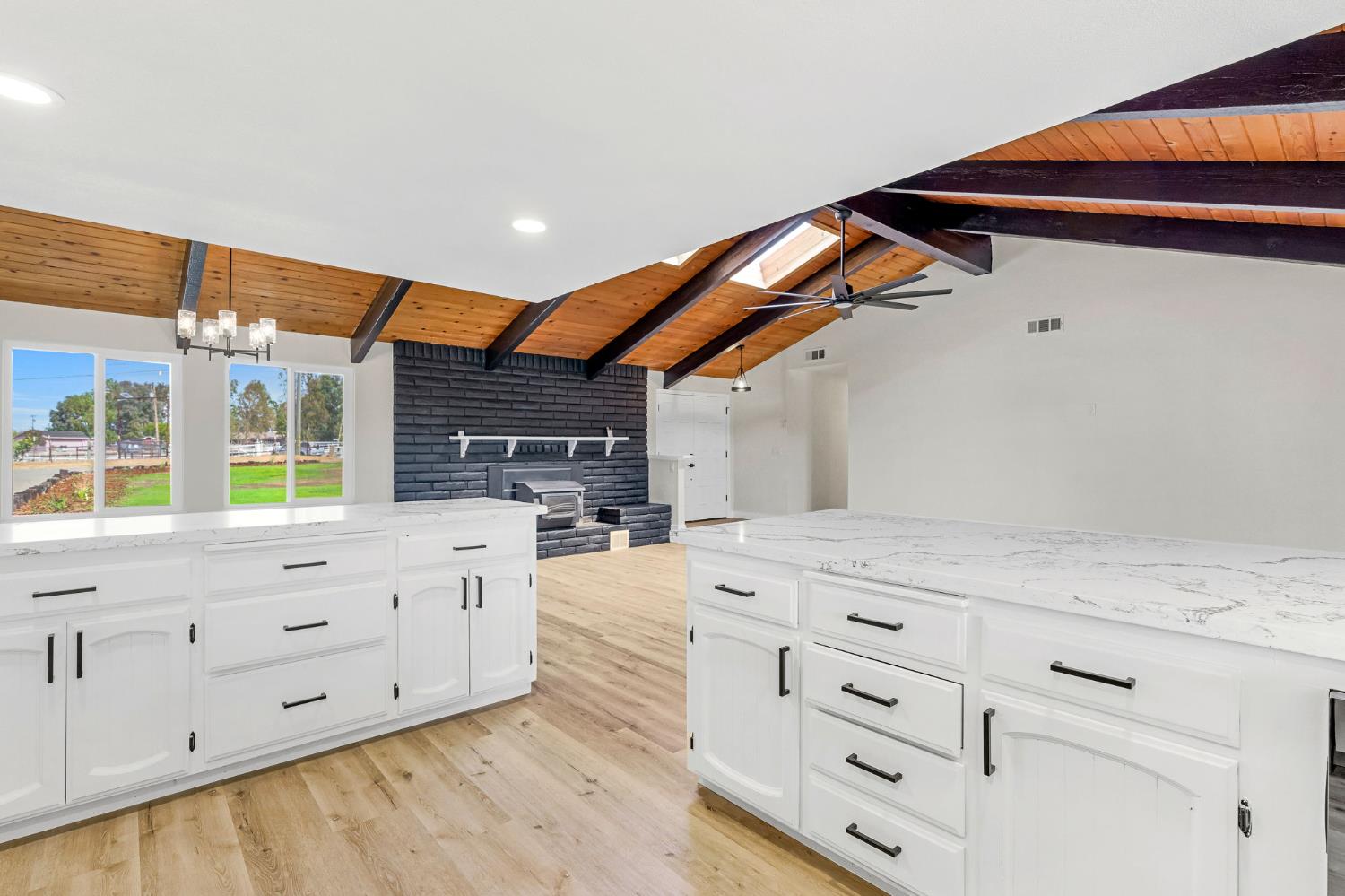 16860 Mark Road Madera, CA 93636 - Photo 14 of 44 a kitchen with granite countertop white cabinets and window
