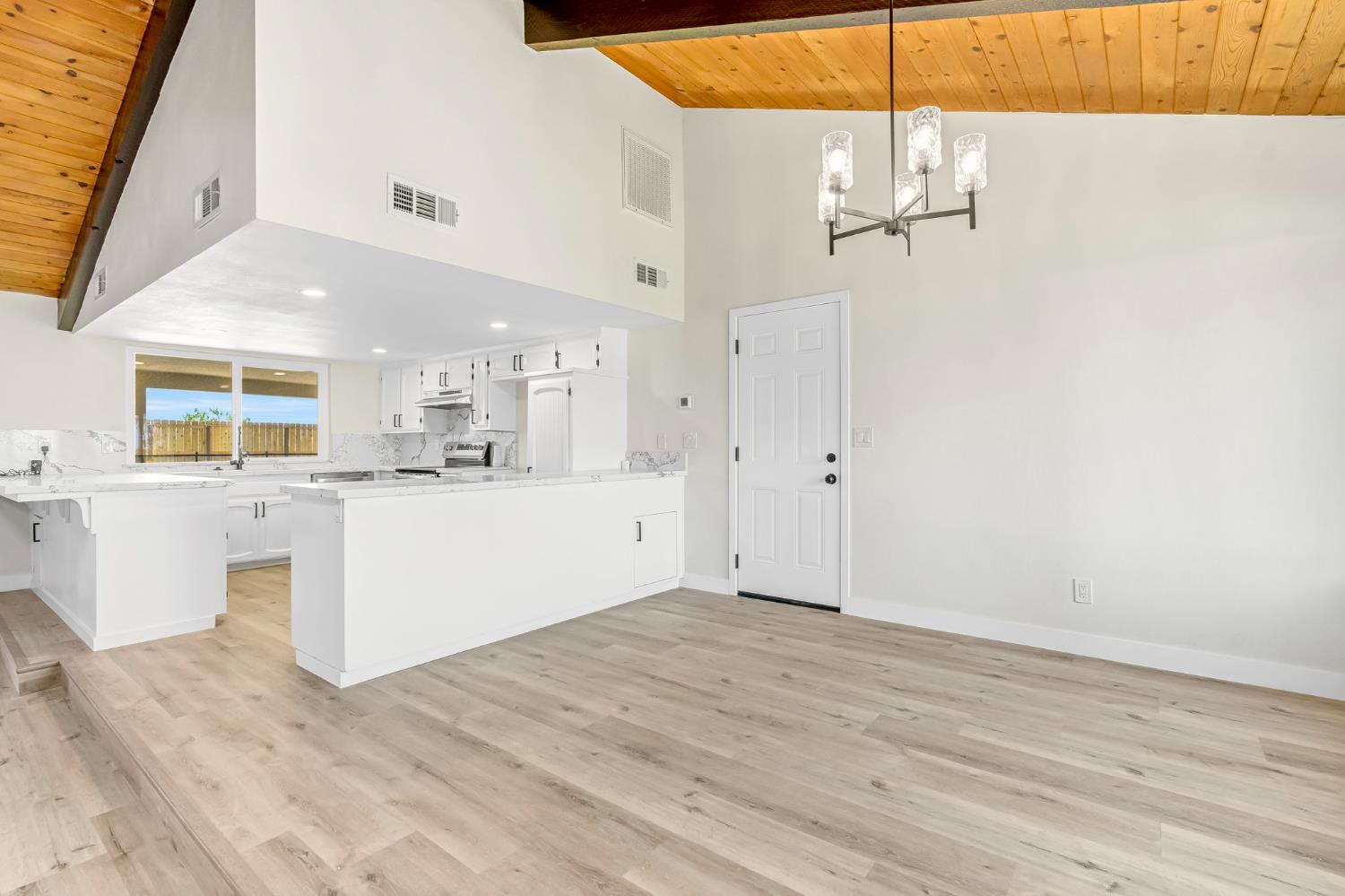 16860 Mark Road Madera, CA 93636 - Photo 17 of 44 a view of a kitchen with wooden floor and windows