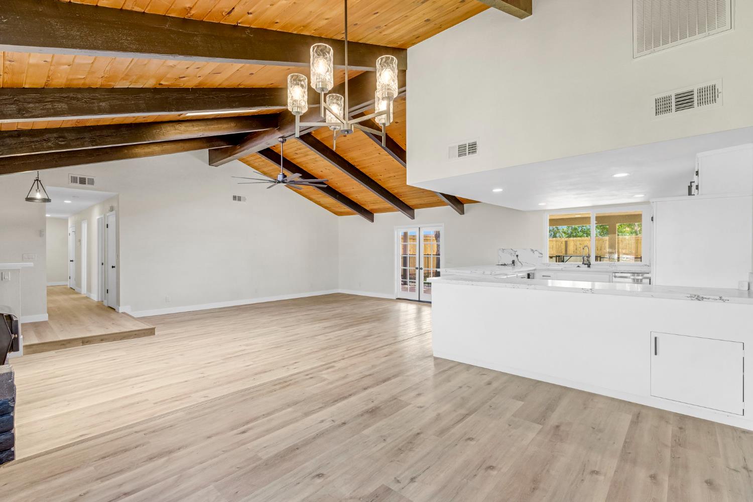 16860 Mark Road Madera, CA 93636 - Photo 18 of 44 a view of a kitchen with wooden floor and a ceiling fan