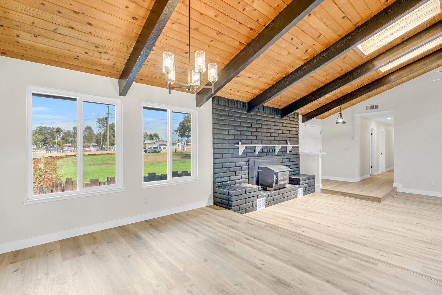16860 Mark Road Madera, CA 93636 - Photo 19 of 44 a view of a livingroom with a fireplace and next to a window