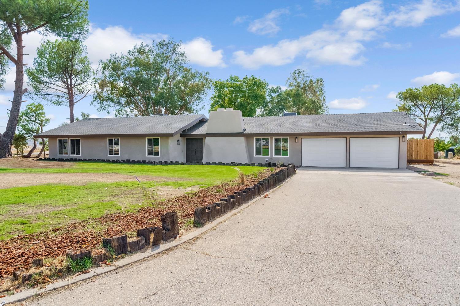 16860 Mark Road Madera, CA 93636 - Photo 2 of 44 a house with swimming pool in front of it