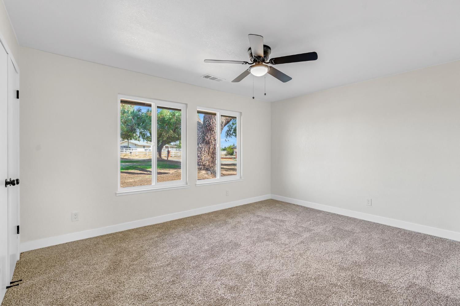 16860 Mark Road Madera, CA 93636 - Photo 22 of 44 a view of an empty room with a window