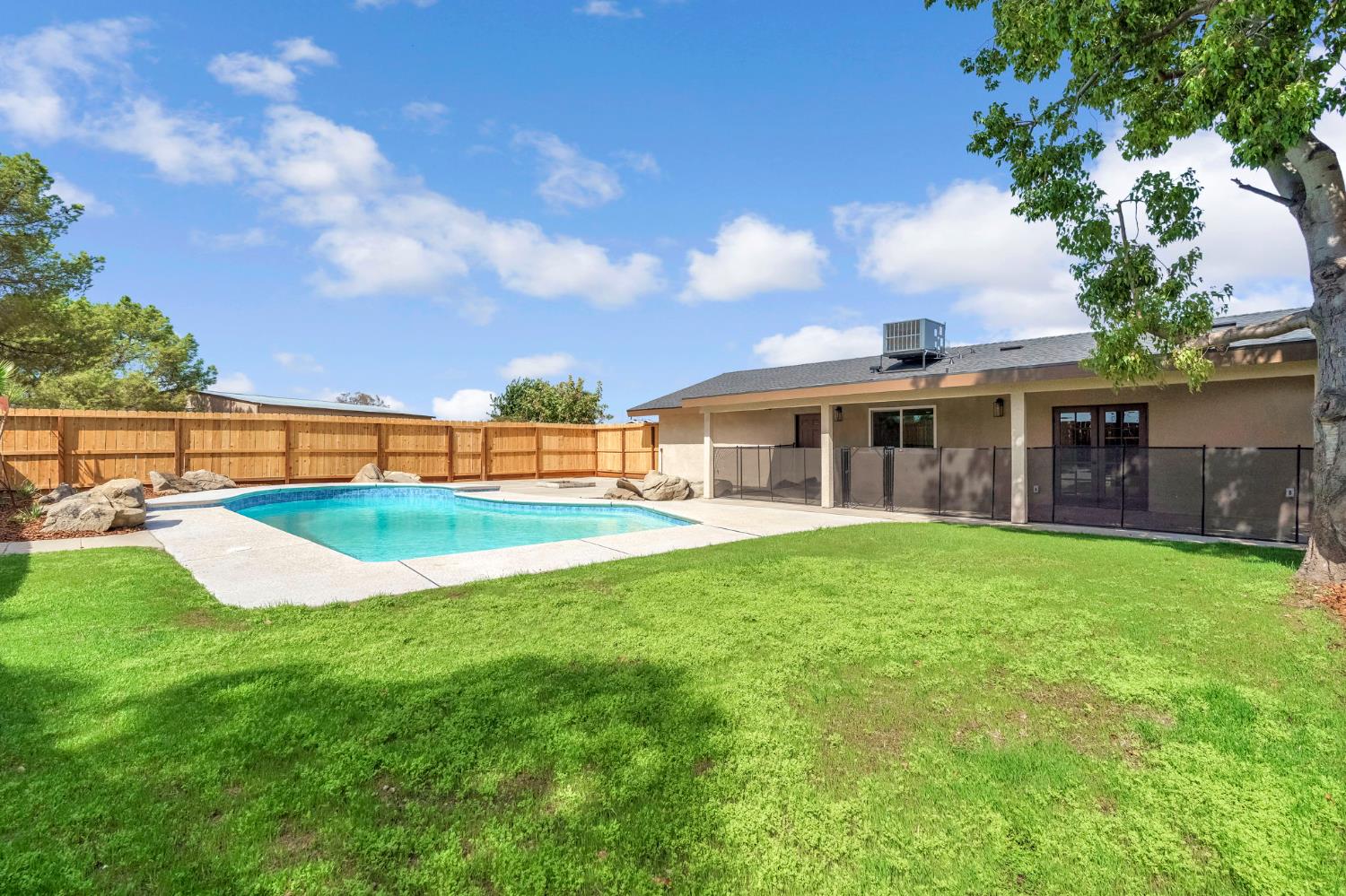 16860 Mark Road Madera, CA 93636 - Photo 30 of 44 a view of a house with a backyard