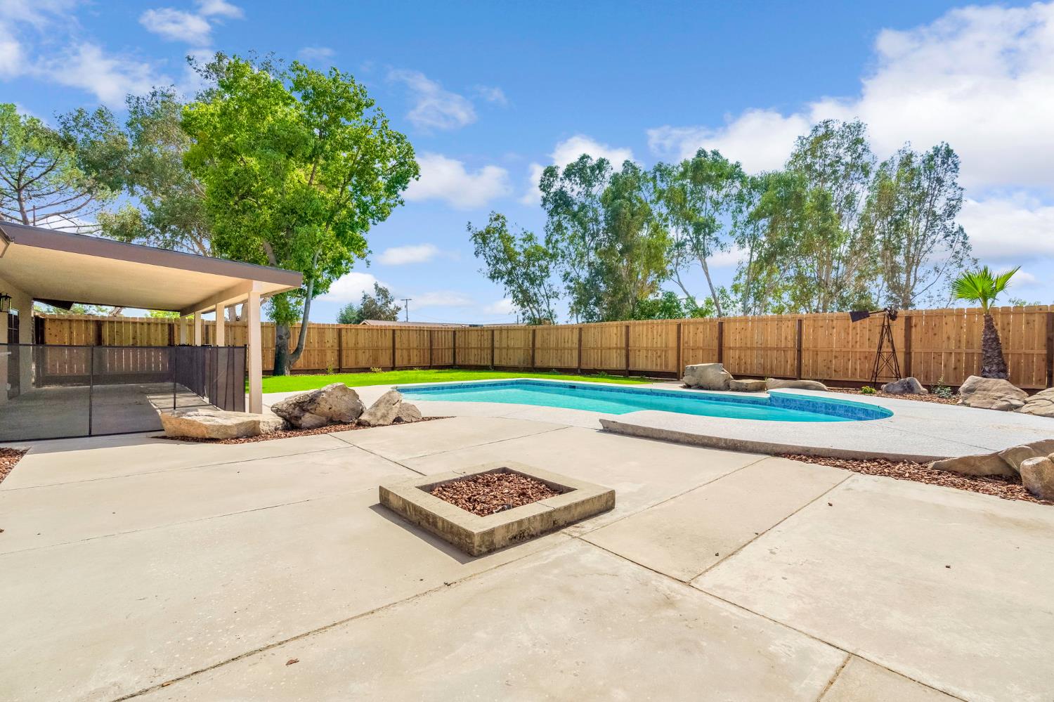 16860 Mark Road Madera, CA 93636 - Photo 3 of 44 a view of a park with a large trees with wooden fence