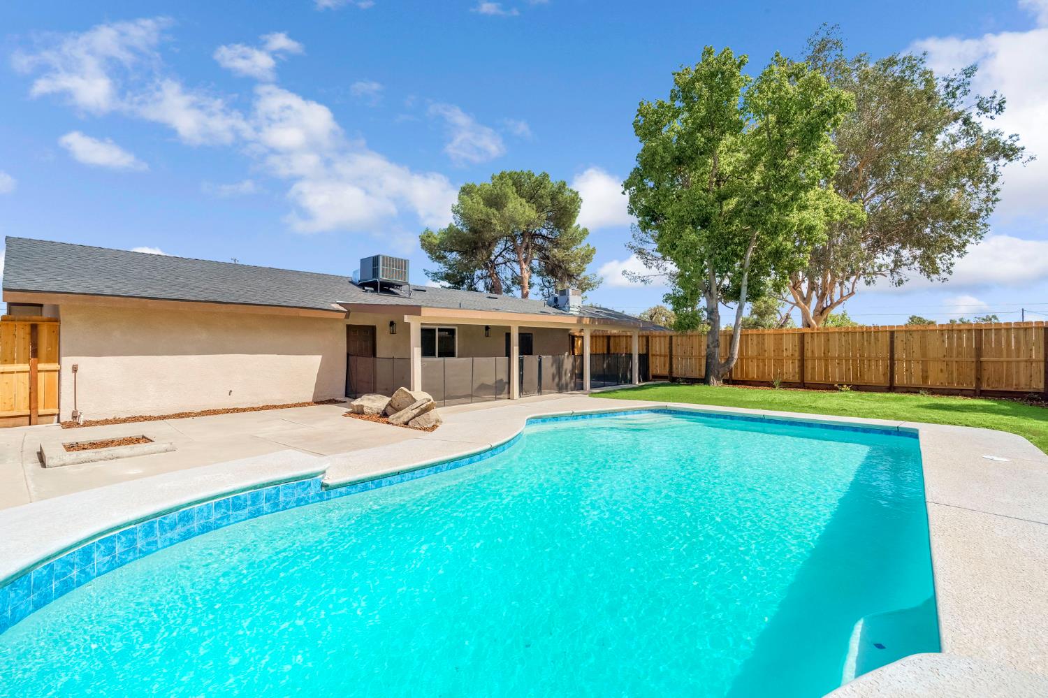 16860 Mark Road Madera, CA 93636 - Photo 31 of 44 a front view of a house with garden