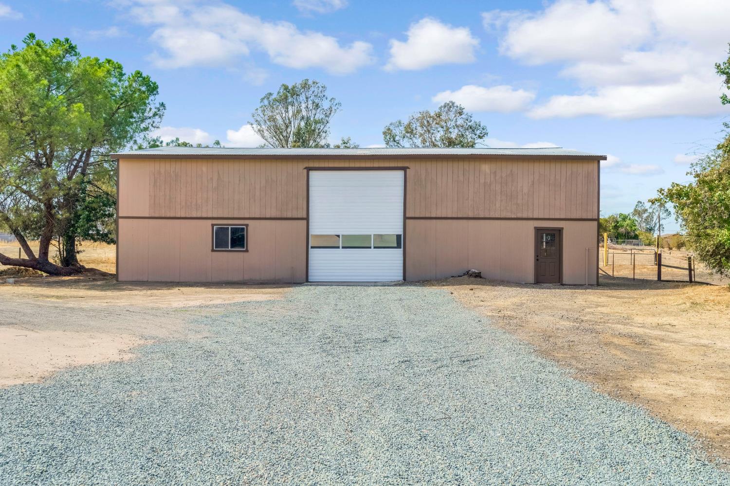 16860 Mark Road Madera, CA 93636 - Photo 32 of 44 front view of a house with a garage